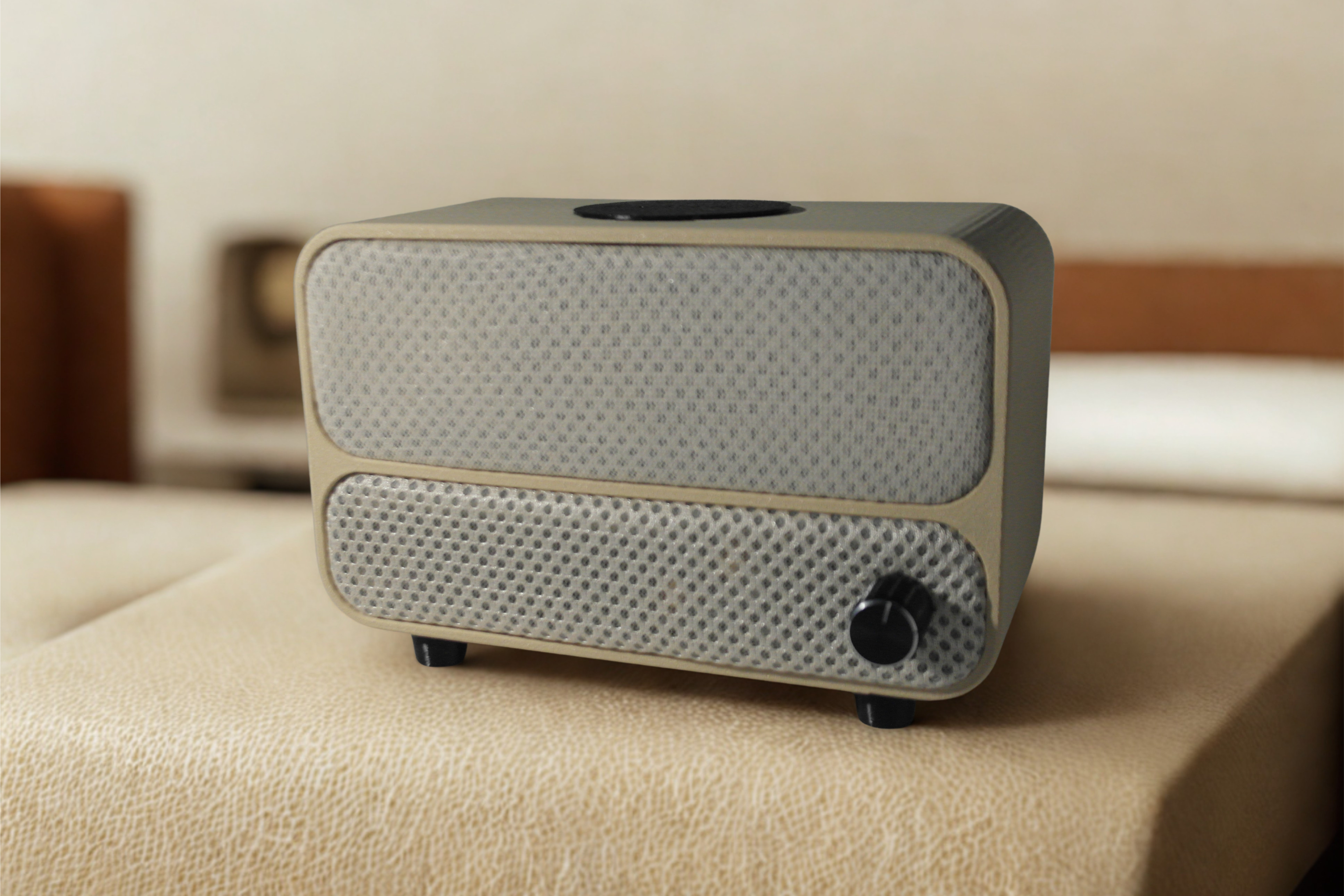 The Aveira One - a sculpted cream clock with woven fabric panels and a single knob